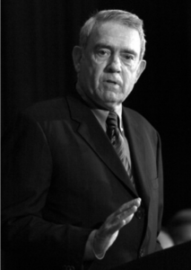 Black and white close-up photo of Dan Rather speaking.